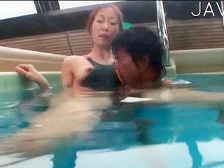Fucking a Japanese babe's luscious nipples in a Tokyo pool